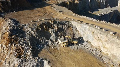 Aerial View of a Limestone Quarry: A Fascinating Look at Heavy Machinery and Natural Resources in Ge