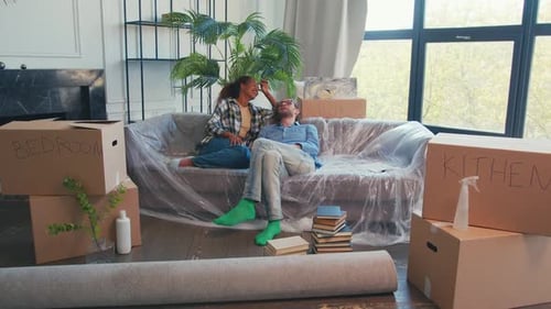 Young Happy Diverse Couple From Man Woman Resting After Moving