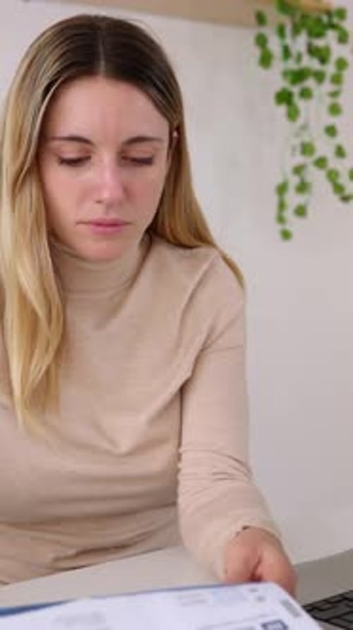 Woman Works at Laptop in Home Office