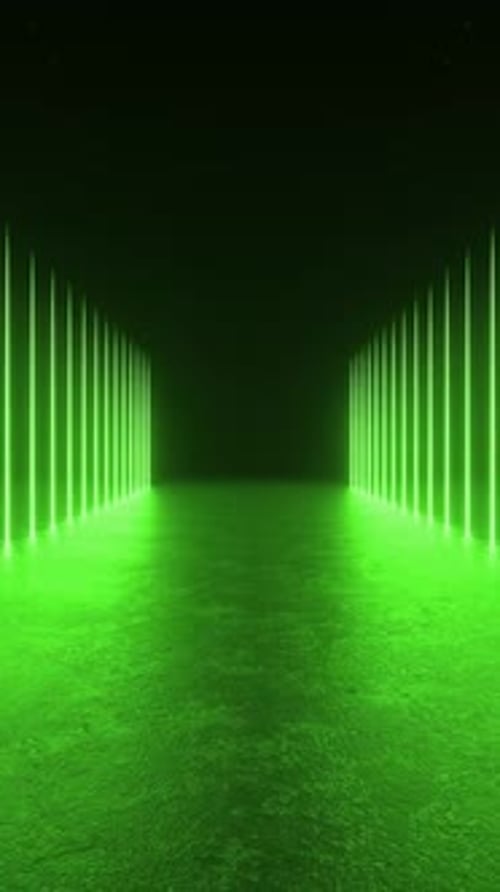 A futuristic tunnel of green lights illuminating a dark room with reflections on the concrete floor.
