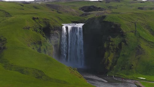 Aerial View of Skogafoss Waterfall with Surrounding Greenery