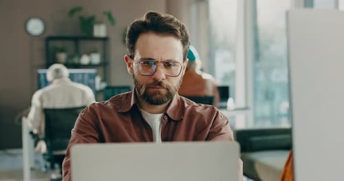 Business, man and reading on computer in office for research, review article and editing draft