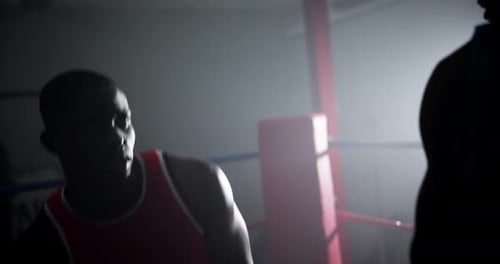 Intense Boxing Training in Dark Boxing Ring
