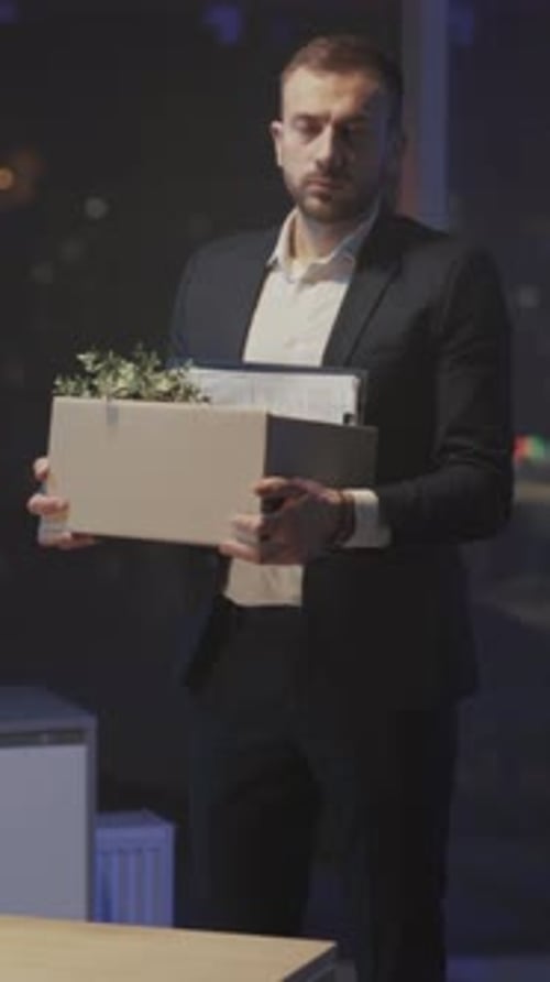 Employee Walks with Cardboard Container Individual Carrying Cardboard Box Through Building Toward