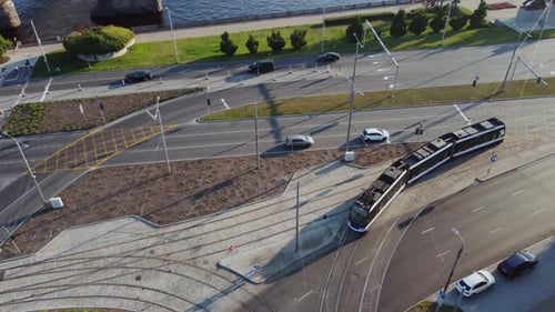 Tram going inside the city aerial view