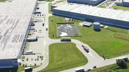 Aerial view of warehouse storages or industrial factory or logistics center from above. Aerial view