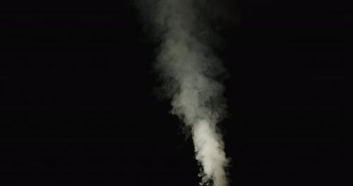 Rising Smoke Against Black Background