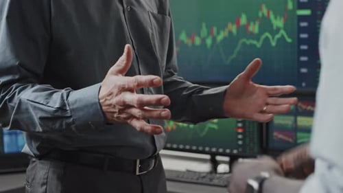 Business Handshake Agreement in Modern Office Setting