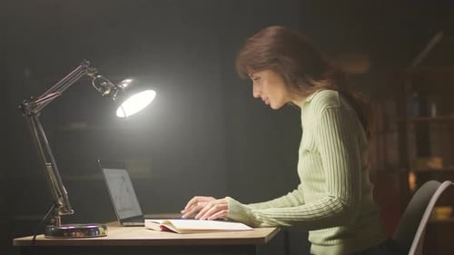 Focused Young Woman Doing Remote Work Footage of Goodlooking Girl Sitting at Computer Desk and Using