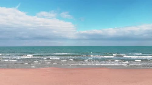 Tropical sandy beach and clear turquoise sea water surface