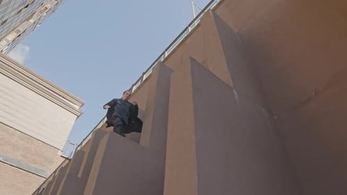 Young Adult Doing Parkour in the City
