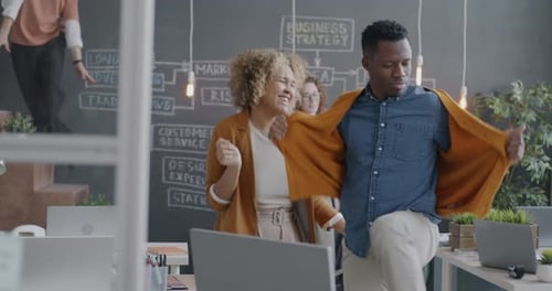 Slow Motion of Joyful Employees Dancing Having Fun Fooling Around in Modern Office
