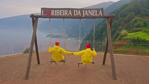 A Couple of Tourists on the Viewpoint From the Swing in Ribera De Janela with an Incredible View of
