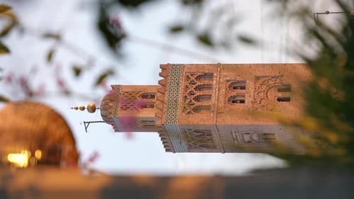 Cinematic vertical shot of the Koutoubia Mosque in Marrakesh.