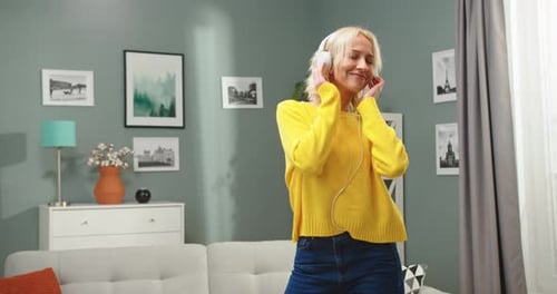 Woman Dancing to Music at Home