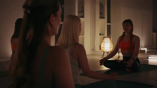 Women Meditating Indoors