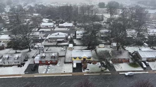 Snowy Aerial View of a Peaceful Neighborhood