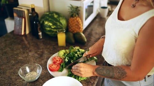 Woman Preparing Healthy Salad in Kitchen