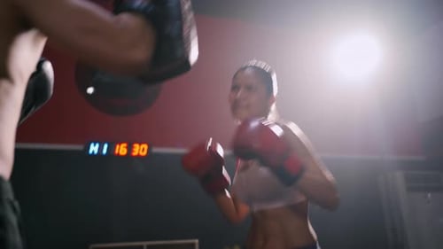 Sporty Coach Training Athlete woman Boxing exercise