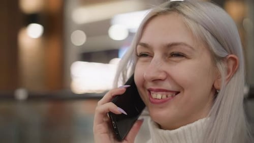 Close Up Model Laughing on Phone Call