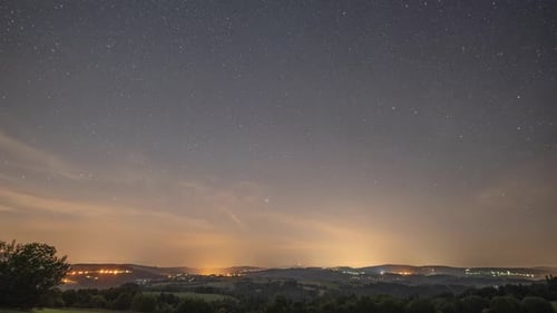 Starry Night Sky over Rural Landscape Time Lapse