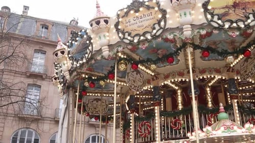 festive traditional carousel spinning around at a Festive Christmas market in Strasbourg, France Eur