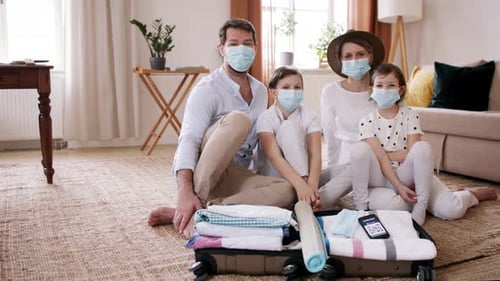 Family Getting Ready For Vacation, Looking At Camera. Coronavirus Concept.