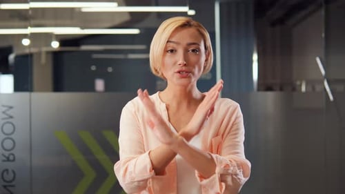 Woman Saying No With Arms Crossed in Office