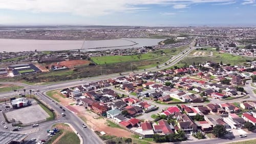 Time lapse of neighbourhood with cars seen traveling along road