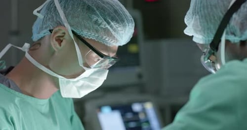 Surgeons Performing Operation in Hospital Operating Room