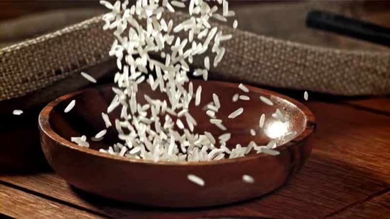Rice is Poured Into a Wooden Bowl Filmed on a Highspeed Camera at 1000 ...