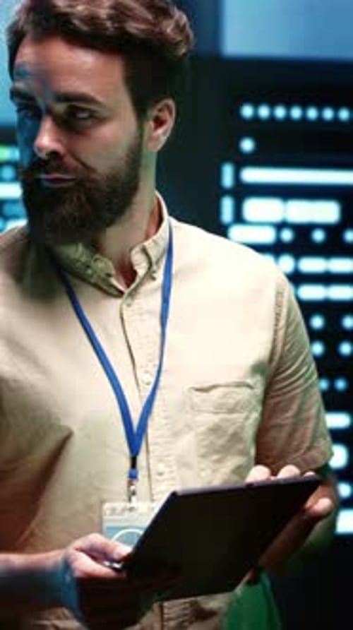 Technician With Tablet in Modern Server Room