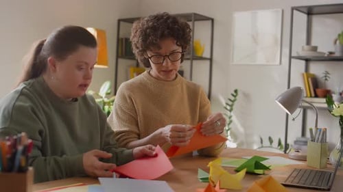Two Women Making Origami Together