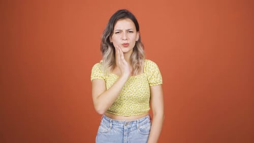 Young woman with toothache.