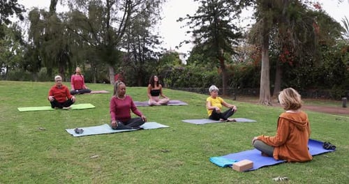 People Doing Yoga Class Keeping Social Distance at City Park - Healthy