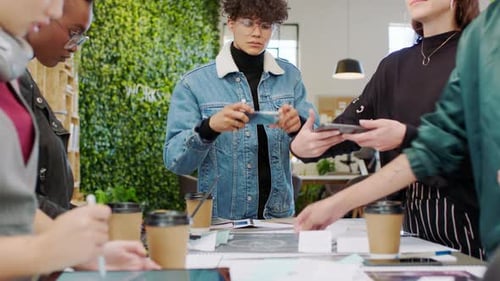 Team Collaborating on Project in Modern Office