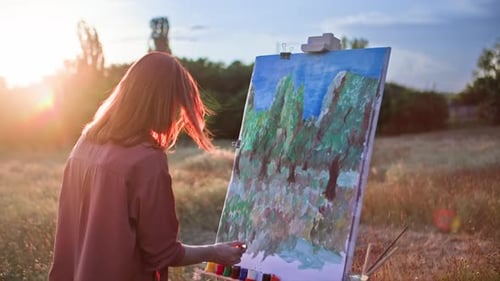 Artistic Hobby a Talented Young Woman with Paints and Brushes Draws a Creative Picture Using an