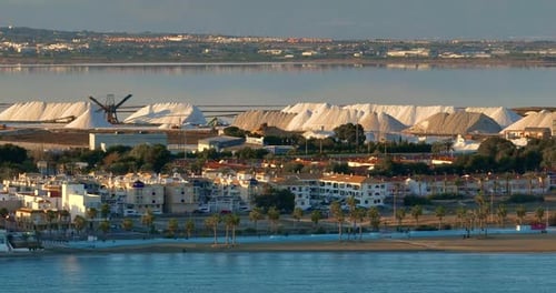 Aerial View of Raw Salt Production Production and Equipment and Salt Stock on a Plant