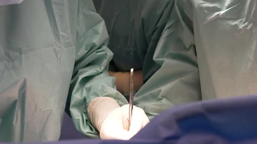 Surgeons Performing Procedure in Operating Room
