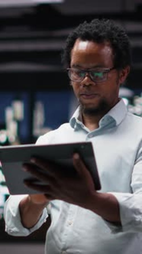 Vertical Video Programmer in Office Developing App Using Tablet Writing Code
