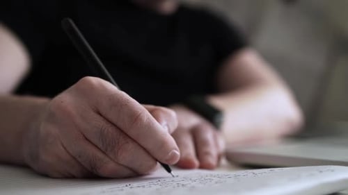 Creative Journaling: Man Working from Home Office