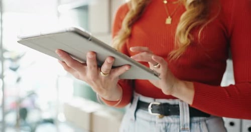 Woman Uses Tablet Device in Office