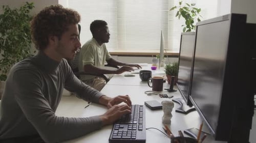 Diverse Programmers Working in Office