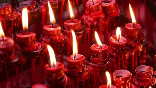 Rows of candles in a church or temple.