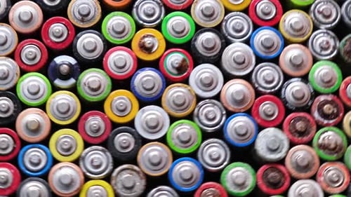 Closeup of Used AA Batteries Finger Batteries Rotate in a Circle Harmful Effects of Batteries