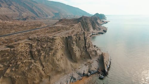 Drone Footage of Rugged Seaside Cliffs and Rocky Shoreline