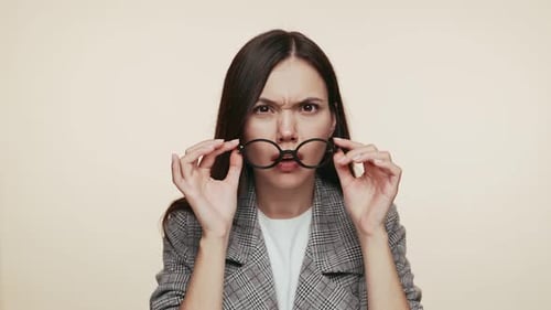 Businesswoman Gesturing Confusion and Annoyance
