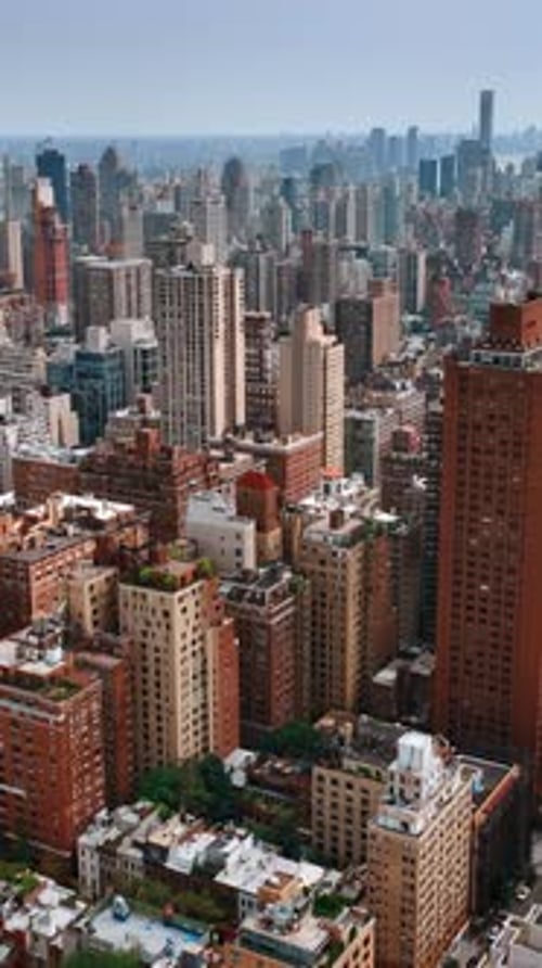 Magnificent cityscape of New York at daytime. Drone footage above the Midtown of metropolis.