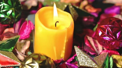 Close Up of Candle with Ornaments and Potpourri