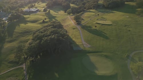 Aerial View of the Green Golf Course Hitting the Ball with a Golf Stick